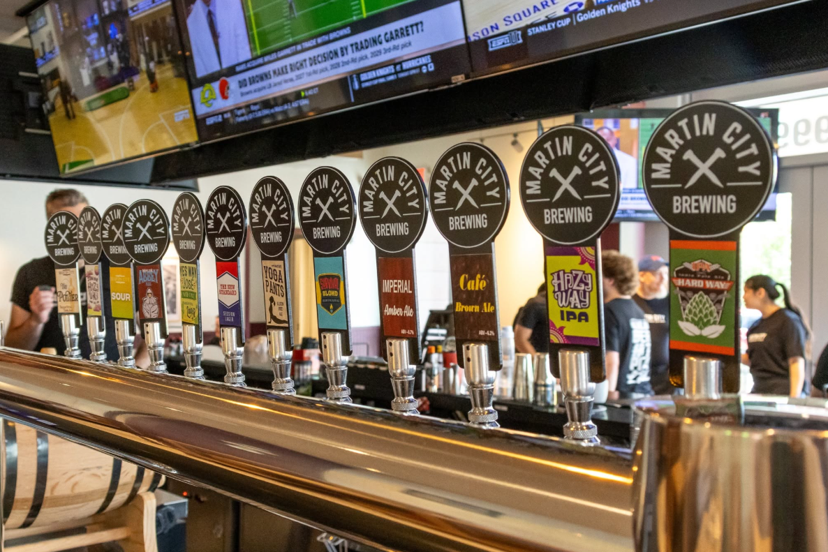 row of draft beer handles with martin city brewing logo